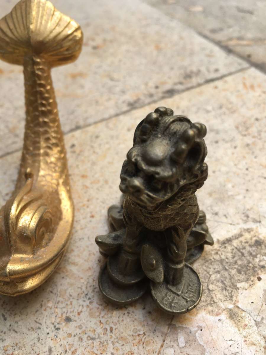 brass foo dog dogs pair with a brass fish