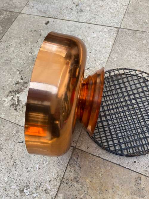 copper round footed vase with frog grate