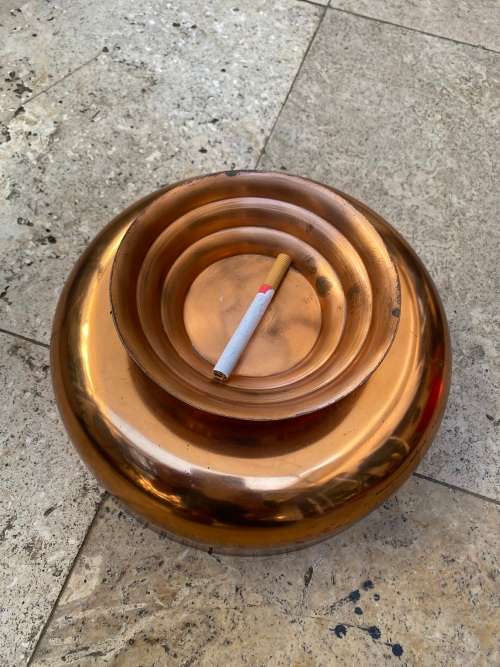 copper round footed vase with frog grate