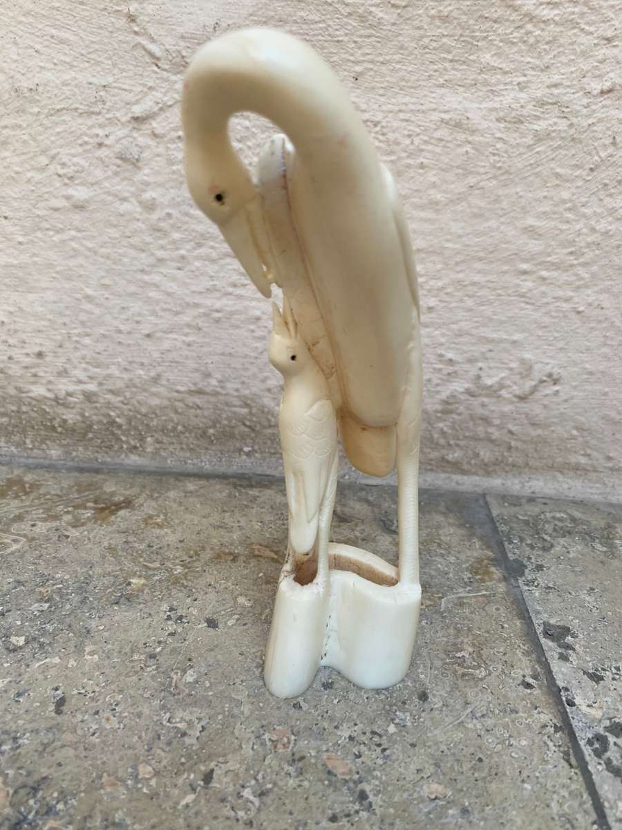 Vintage hand carved bone heron crane bird mother and baby bird feeding figurine