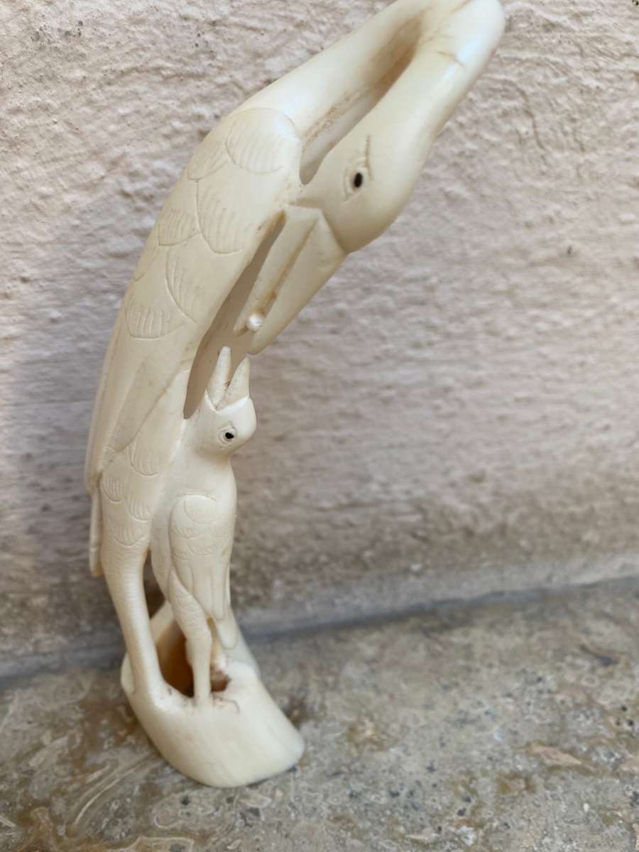 Vintage hand carved bone heron crane bird mother and baby bird feeding figurine