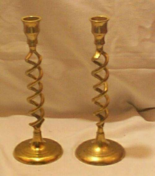 Pair of brass candlesticks, open twist stem 233mm high