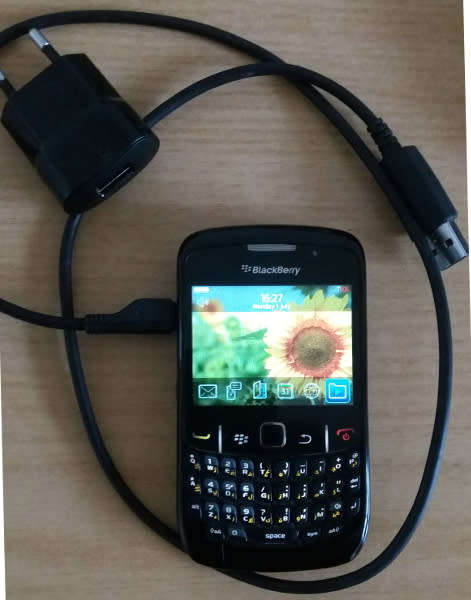 VINTAGE BlackBerry 8520 Cell phone with charger, a usb cable and ear phones