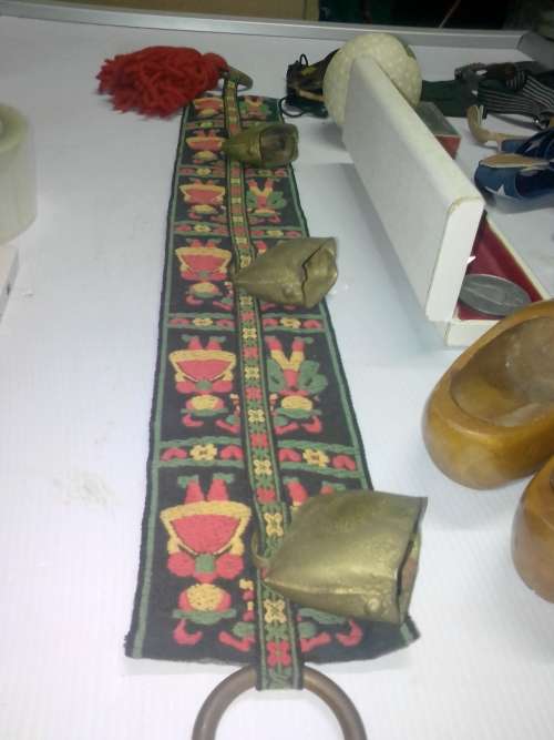 COLLECTABLE ITEMS - sheep bells, wooden Holland shoes, large silver Dias token, and other nice item