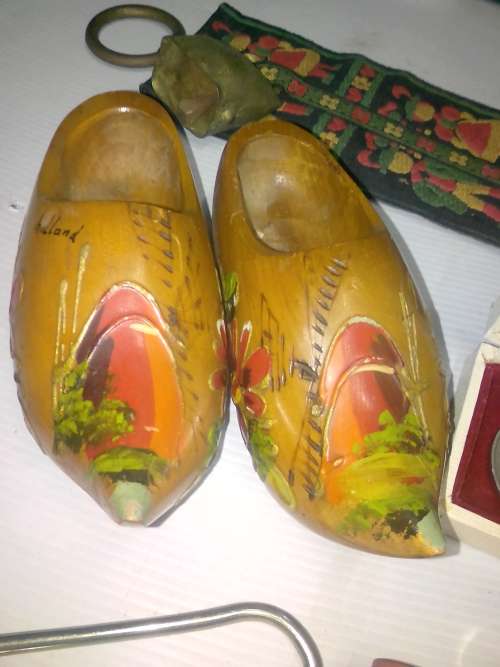 COLLECTABLE ITEMS - sheep bells, wooden Holland shoes, large silver Dias token, and other nice item