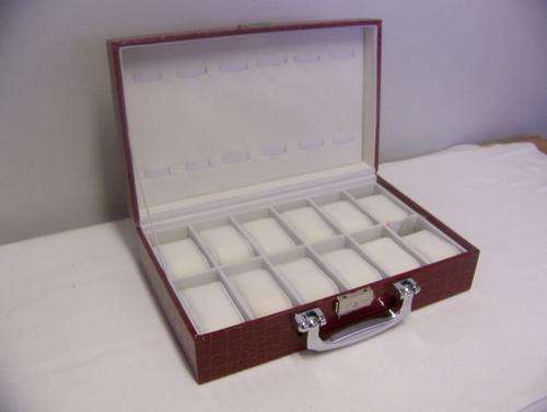 Stitched Maroon Leatherette watch case. Holds 24 watches.