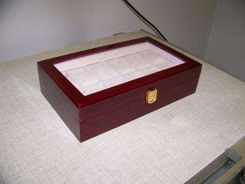 Mahogany finish watch display case. 12 Partitions with transparent lid.