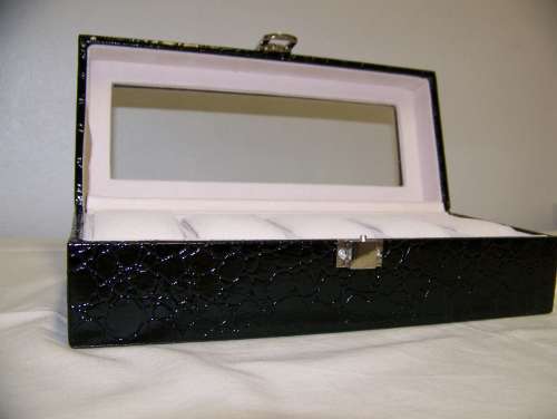 Leatherette watch display holds 5 watches