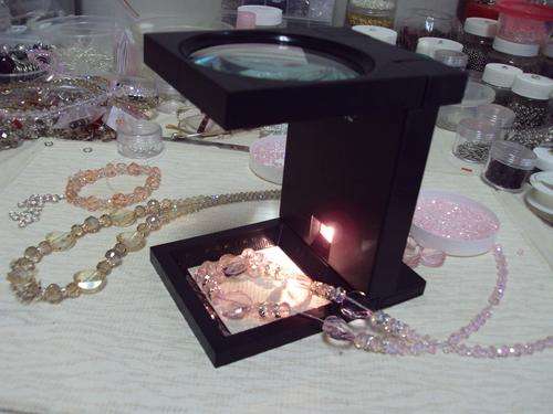 Magnifying glass with light.