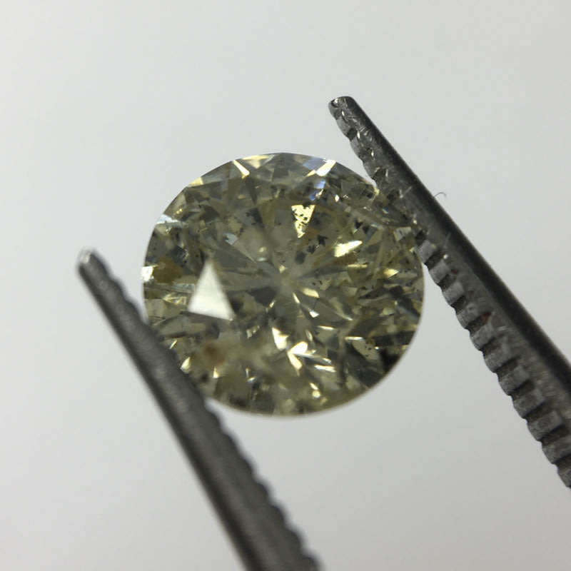0.68 carat U-V - fancy light yellow I3 round brilliant diamond
