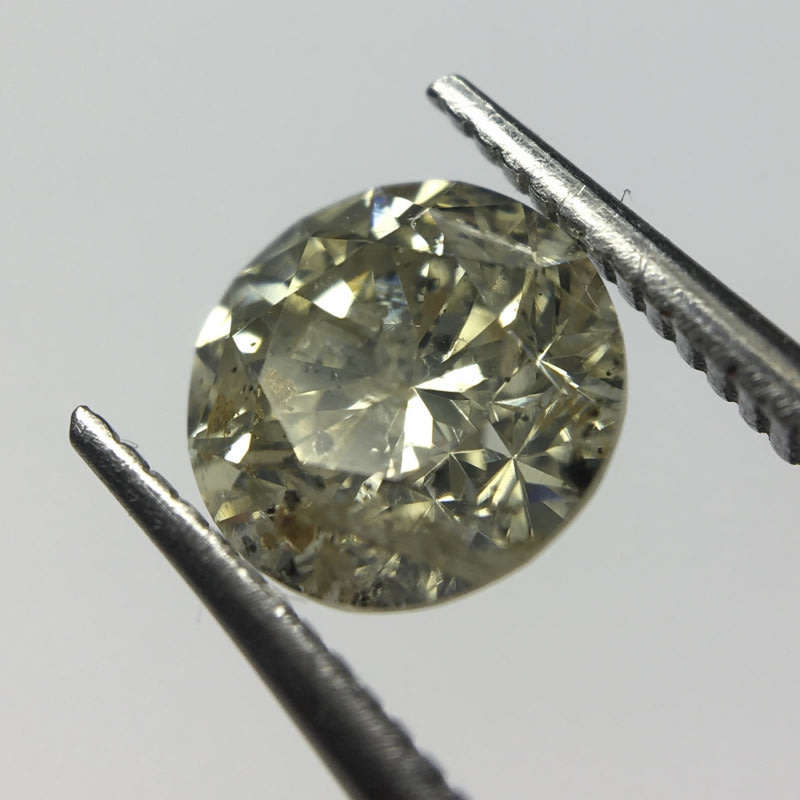 0.68 carat U-V - fancy light yellow I3 round brilliant diamond