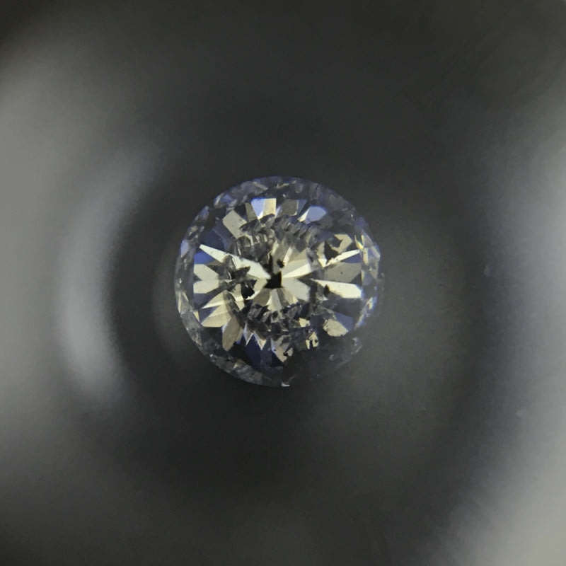 0.68 carat U-V - fancy light yellow I3 round brilliant diamond