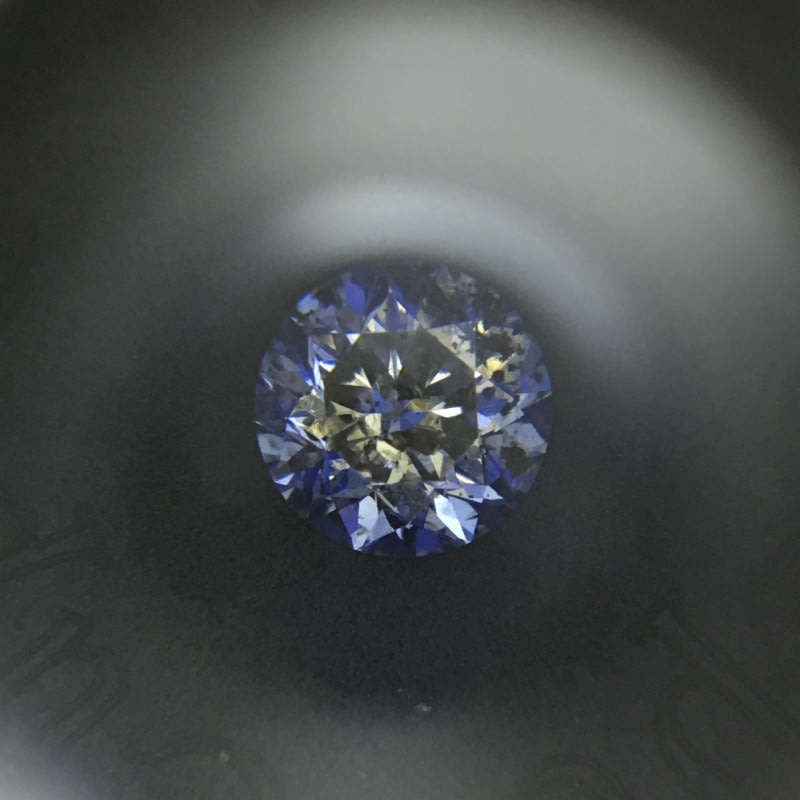 0.68 carat U-V - fancy light yellow I3 round brilliant diamond