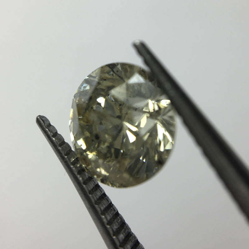 0.68 carat U-V - fancy light yellow I3 round brilliant diamond