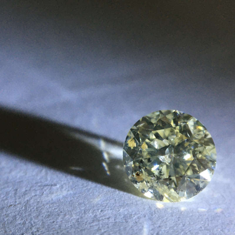 0.68 carat U-V - fancy light yellow I3 round brilliant diamond