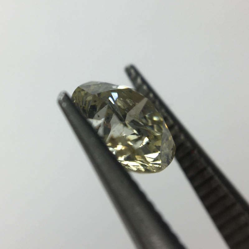 0.68 carat U-V - fancy light yellow I3 round brilliant diamond