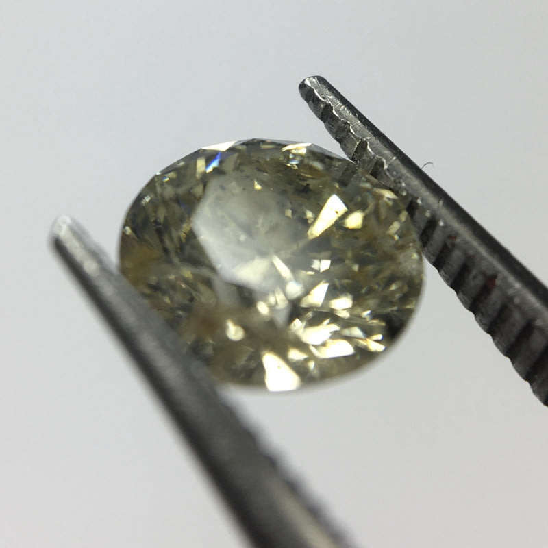 0.68 carat U-V - fancy light yellow I3 round brilliant diamond