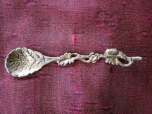 Sweet handcrafted  vintage sugar spoon with leaves and flower motif, very unique