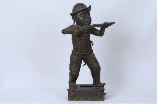 Brass figure of a Portuguese soldier holding a musket - Benin Nigeria