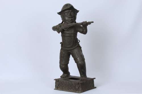 Brass figure of a Portuguese soldier holding a musket - Benin Nigeria