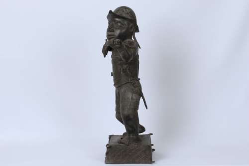 Brass figure of a Portuguese soldier holding a musket - Benin Nigeria