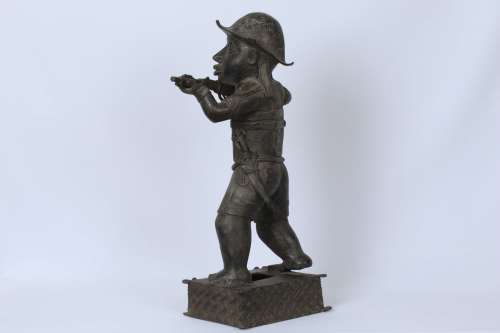 Brass figure of a Portuguese soldier holding a musket - Benin Nigeria