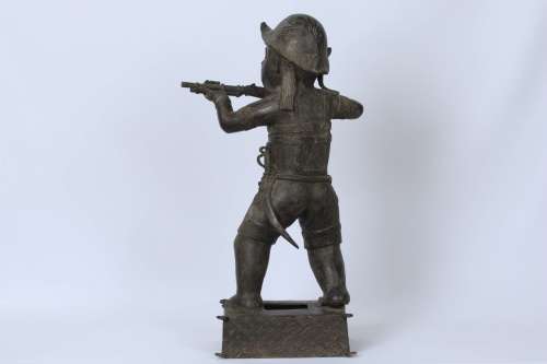 Brass figure of a Portuguese soldier holding a musket - Benin Nigeria