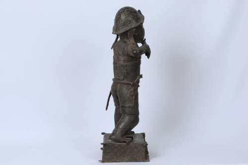Brass figure of a Portuguese soldier holding a musket - Benin Nigeria