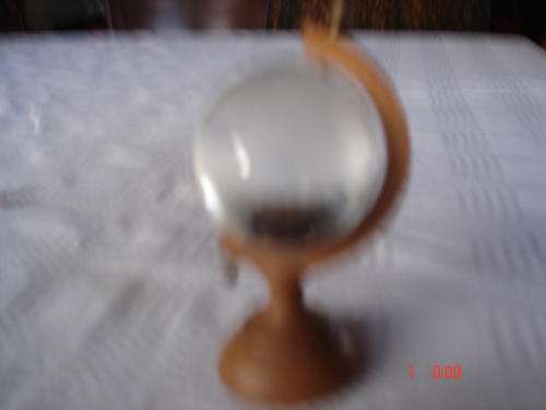 globe on wooden stand h.12cm in good nick.world sandblasted on glass.