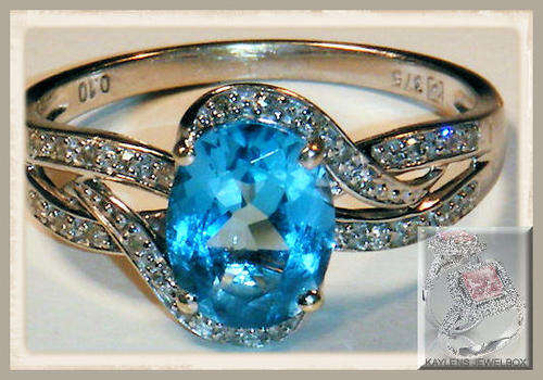 Irresistible and breathtaking: A FINE 9CT WHITE GOLD BLUE TOPAZ & DIAMOND RING SIZE R