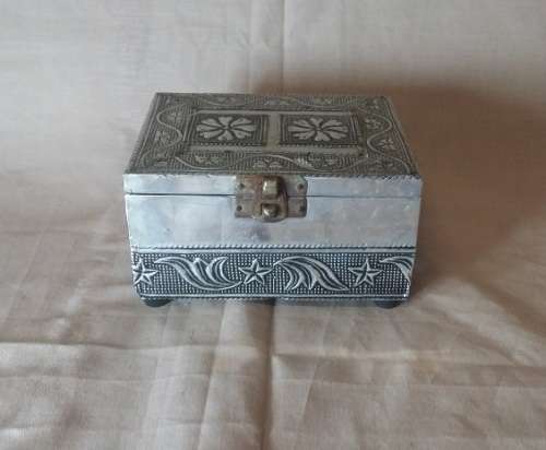 A METAL TRINKET BOX  BLACK MATERIAL  LINED