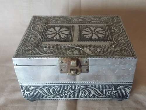 A METAL TRINKET BOX  BLACK MATERIAL  LINED