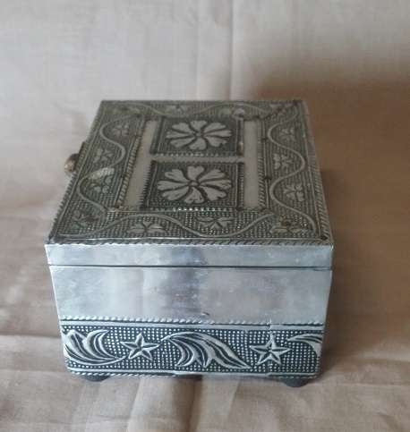 A METAL TRINKET BOX  BLACK MATERIAL  LINED