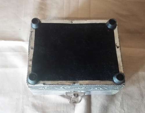 A METAL TRINKET BOX  BLACK MATERIAL  LINED