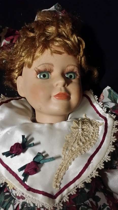 A LARGE VINTAGE PORCELAIN DOLL