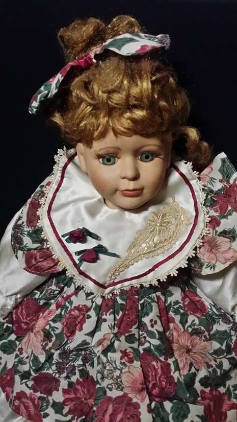 A LARGE VINTAGE PORCELAIN DOLL