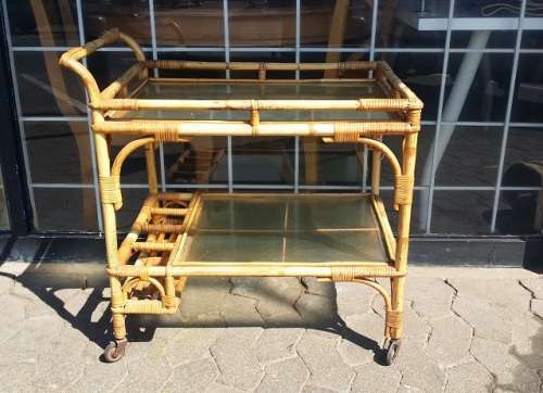 A CANE DRINKS TROLLEY ON CASTOR /  WHEELS