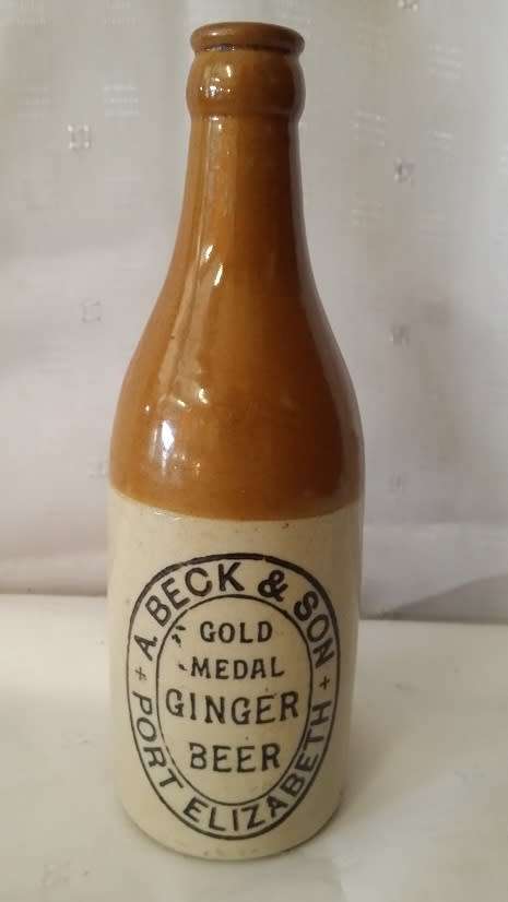 VINTAGE  A BECK AND SON GOLD METAL GINGER BEER BOTTLE