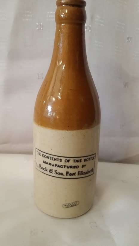 VINTAGE  A BECK AND SON GOLD METAL GINGER BEER BOTTLE