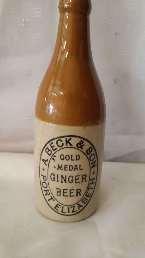 VINTAGE  A BECK AND SON GOLD METAL GINGER BEER BOTTLE