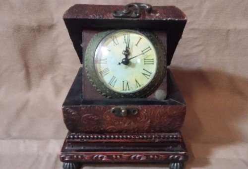 CLOCK CASED IN WOODEN BOX