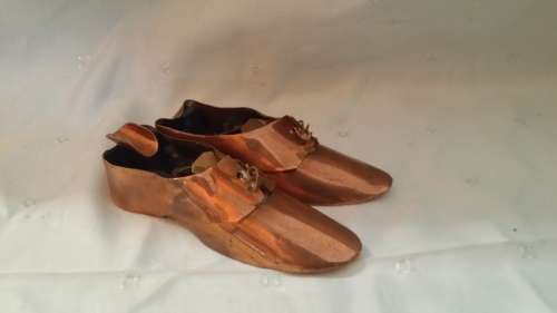 TWO COPPER SHOES