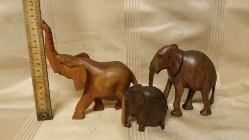SET OF THREE WOODEN ELEPHANT ORNAMENTS