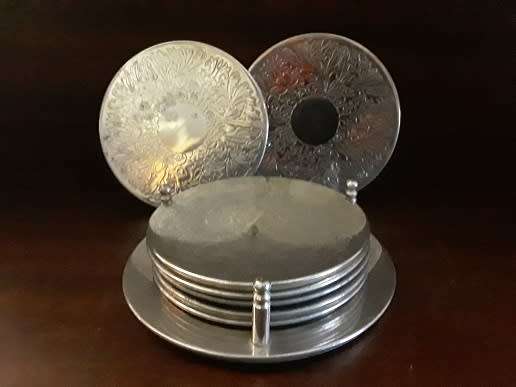 Seven Silver Plated Coasters with Stand