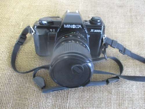 Popular Vintage Minolta X-300s SLR Camera With Film And Attached Minolta MD Zoom 28 - 70 mm Lens
