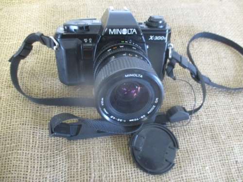 Popular Vintage Minolta X-300s SLR Camera With Film And Attached Minolta MD Zoom 28 - 70 mm Lens
