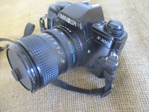 Popular Vintage Minolta X-300s SLR Camera With Film And Attached Minolta MD Zoom 28 - 70 mm Lens