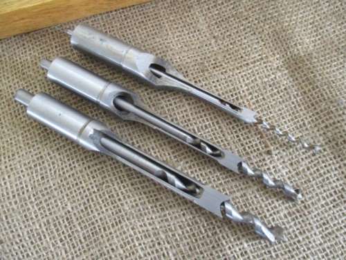 Nice Set Of Square Hole Drill Bits In A Beveld Edged Lidded Wooden Box Plus Drill Attachment.