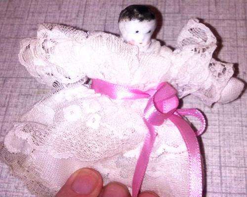 Very old small doll. About 8cm in size.