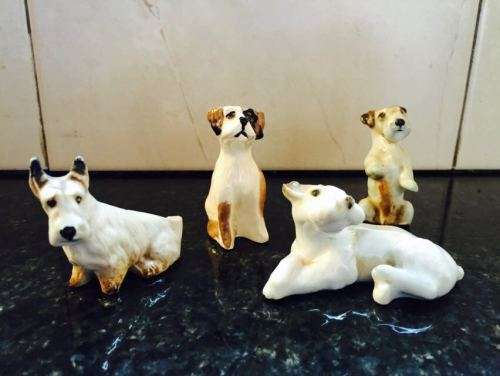Four Cute Ceramic Dog Ornaments